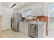 Kitchen with stainless steel appliances, white cabinets, and ample counter space at 316 Watercress Dr., Longs, SC 29568