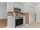 Kitchen featuring stainless steel appliances, white cabinets, and tile backsplash at 316 Watercress Dr., Longs, SC 29568