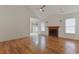 Spacious living room featuring wood floors, vaulted ceiling, and a fireplace at 316 Watercress Dr., Longs, SC 29568