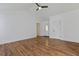 Open living space with hardwood floors, a front door, and neutral walls at 316 Watercress Dr., Longs, SC 29568