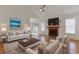 Bright living room with hardwood floors, fireplace, and access to the backyard at 316 Watercress Dr., Longs, SC 29568