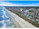 High aerial view of a beachfront condo with beach access with marsh views in the distance at 4000 N Ocean Blvd. # 506, North Myrtle Beach, SC 29582