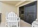 Balcony with patio furniture and view to living space at 4000 N Ocean Blvd. # 506, North Myrtle Beach, SC 29582