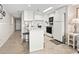 Efficient kitchen space with white cabinetry, breakfast bar, and modern appliances at 4000 N Ocean Blvd. # 506, North Myrtle Beach, SC 29582