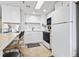 Bright, efficient kitchen featuring white appliances and plenty of counter space at 4000 N Ocean Blvd. # 506, North Myrtle Beach, SC 29582