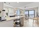 Cozy living space includes breakfast bar and a sliding door to a balcony with ocean views at 4000 N Ocean Blvd. # 506, North Myrtle Beach, SC 29582
