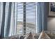 A close up of ocean view from inside the residence, showcasing the beach and swimming pool at 4000 N Ocean Blvd. # 506, North Myrtle Beach, SC 29582
