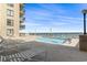 Sunny outdoor pool with ocean views and plenty of seating and deck furniture for relaxing at 4000 N Ocean Blvd. # 506, North Myrtle Beach, SC 29582