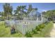 Charming home with a white picket fence and inviting curb appeal with a cozy outdoor seating area at 401 17Th Ave. S, North Myrtle Beach, SC 29582