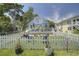 Charming home with a white picket fence, inviting curb appeal, and a lovely outdoor seating area at 401 17Th Ave. S, North Myrtle Beach, SC 29582