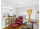 A cozy living room featuring hardwood floors, comfortable seating, and a pass-through to the adjacent kitchen at 401 17Th Ave. S, North Myrtle Beach, SC 29582