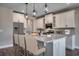 Well-appointed kitchen featuring granite countertops, stainless steel appliances, and a large island with seating at 4023 Braid Ct., Myrtle Beach, SC 29588