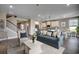 Bright and airy living room seamlessly connects to the kitchen, featuring stylish decor and a comfortable seating area at 4023 Braid Ct., Myrtle Beach, SC 29588