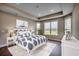 Serene main bedroom featuring a comfortable bed, ample natural light, and a relaxing ambiance at 4023 Braid Ct., Myrtle Beach, SC 29588