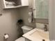 Clean bathroom boasts a toilet, sink, mirror, and cabinet storage for a functional space at 415 Ocean Creek Dr. # 2117, Myrtle Beach, SC 29572
