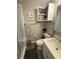 Neat bathroom features a shower, toilet, vanity, and organized storage, complete with decorative towels at 415 Ocean Creek Dr. # 2117, Myrtle Beach, SC 29572