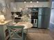 Compact kitchen with modern appliances and a cozy dining area at 415 Ocean Creek Dr. # 2117, Myrtle Beach, SC 29572