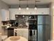 Modern, compact kitchen space with stainless steel appliances at 415 Ocean Creek Dr. # 2117, Myrtle Beach, SC 29572