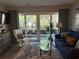 Comfortable living room with a balcony view and modern decor at 415 Ocean Creek Dr. # 2117, Myrtle Beach, SC 29572