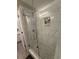 Modern shower with sleek glass door, tiled walls, and built-in niche for toiletries at 415 Ocean Creek Dr. # 2117, Myrtle Beach, SC 29572