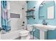Bathroom with a sleek subway tiled shower and a modern pedestal sink at 4303 South Ocean Blvd. # 303, North Myrtle Beach, SC 29582