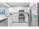 Kitchen featuring modern stainless steel appliances and ample cabinet space at 4303 South Ocean Blvd. # 303, North Myrtle Beach, SC 29582