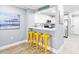 Bright kitchen with white cabinets and bar seating at 4303 South Ocean Blvd. # 303, North Myrtle Beach, SC 29582