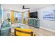 Bright living room featuring a ceiling fan and an ocean view at 4303 South Ocean Blvd. # 303, North Myrtle Beach, SC 29582