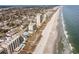 Sweeping aerial view showcasing the beachfront condos and sandy shoreline at 4307 Beverly Ct., North Myrtle Beach, SC 29582