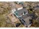 Aerial view of coastal home featuring a second story deck with chairs and lovely landscaping at 4307 Beverly Ct., North Myrtle Beach, SC 29582