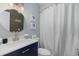 Powder room with white marble vanity and wood accent wall at 4307 Beverly Ct., North Myrtle Beach, SC 29582