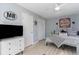 Inviting bedroom with a TV, closet, and beach-themed decor at 4307 Beverly Ct., North Myrtle Beach, SC 29582