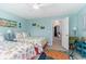 Bright bedroom features two beds, coastal decor and an open doorway to the hall at 4307 Beverly Ct., North Myrtle Beach, SC 29582