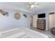Comfortable bedroom with light blue walls and views to an en suite bathroom at 4307 Beverly Ct., North Myrtle Beach, SC 29582