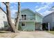 Charming, light blue, two-story home with a cozy front porch and a second-story balcony at 4307 Beverly Ct., North Myrtle Beach, SC 29582