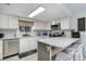 Bright kitchen features granite counters, stainless steel appliances, and modern lighting at 4307 Beverly Ct., North Myrtle Beach, SC 29582
