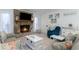 The bright living room features a stone fireplace, coastal decor, and plush seating at 4307 Beverly Ct., North Myrtle Beach, SC 29582
