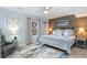 Coastal bedroom featuring a wood accent wall, a large bed with decorative pillows, and beach-themed decor at 4307 Beverly Ct., North Myrtle Beach, SC 29582