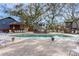 Beautiful community pool with surrounding lounge seating and mature trees at 4307 Beverly Ct., North Myrtle Beach, SC 29582