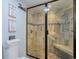 Updated shower with tile surround, built-in bench and frameless glass door at 4307 Beverly Ct., North Myrtle Beach, SC 29582