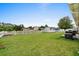 Expansive backyard with a white picket fence, storage shed, and plenty of green space at 4639 Mandi Ave., Little River, SC 29566