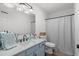 Bright bathroom featuring a stylish vanity with marble countertop and a shower-tub combination at 4639 Mandi Ave., Little River, SC 29566