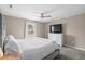 Comfortable bedroom featuring a ceiling fan, neutral walls, plush carpet, and a bright window view at 4639 Mandi Ave., Little River, SC 29566