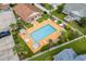 Inviting community pool area featuring lounge chairs, umbrellas, and lush landscaping, perfect for relaxation and social gatherings at 4639 Mandi Ave., Little River, SC 29566