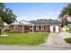 Charming brick home with a well-manicured lawn and an inviting front porch and two car garage at 4639 Mandi Ave., Little River, SC 29566