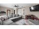 Relaxing living room with a large sectional sofa, a sliding barn door, and a wall-mounted TV at 4639 Mandi Ave., Little River, SC 29566