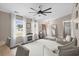 Sunny living room featuring modern furnishings, beautiful floors and neutral walls, and a ceiling fan at 4639 Mandi Ave., Little River, SC 29566
