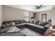Comfortable living room with large sectional sofa, soft lighting, and a patterned rug. Perfect for relaxing at 4639 Mandi Ave., Little River, SC 29566