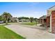 Charming neighborhood street view featuring well-maintained lawns and inviting curb appeal, enhanced by beautiful palm trees at 4639 Mandi Ave., Little River, SC 29566