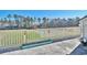 Wide balcony overlooking a lush green space surrounded by tall trees offering a peaceful outdoor retreat at 510 Fairwood Lakes Dr. # 18N, Myrtle Beach, SC 29577